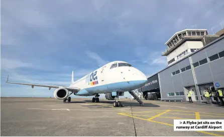  ??  ?? > A Flybe jet sits on the runway at Cardiff Airport