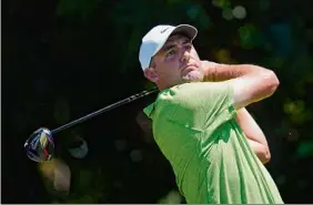  ?? Tony Gutierrez / Associated Press ?? Scottie Scheffler hits off the sixth tee during the first round of the Charles Schwab Challenge at Colonial Country Club. He didn’t have a bogey.