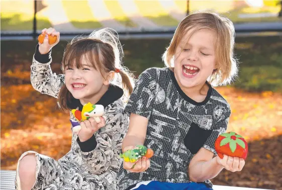  ?? Picture: AAP IMAGE ?? Lara, 6, and Eamon Ferguson, 8, play with Squishies which have been banned in Denmark over health concerns.