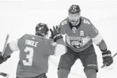  ?? WILFREDO LEE/AP ?? Panthers defenseman Keith Yandle congratula­tes defenseman Aaron Ekblad (5) after Ekblad scored a goal during the second period of Monday’s game vs. the Blackhawks in Sunrise.