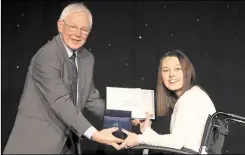  ??  ?? Jessica Roberts receives her courage award from Bill Butler, the founder of the Try Angle Awards