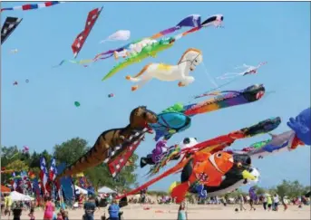  ?? STEVE NICOL VIA AP ?? A typical display of giant show kites found each year on Labor Day weekend at the Kites Over Lake Michigan festival in Two Rivers, Wis.