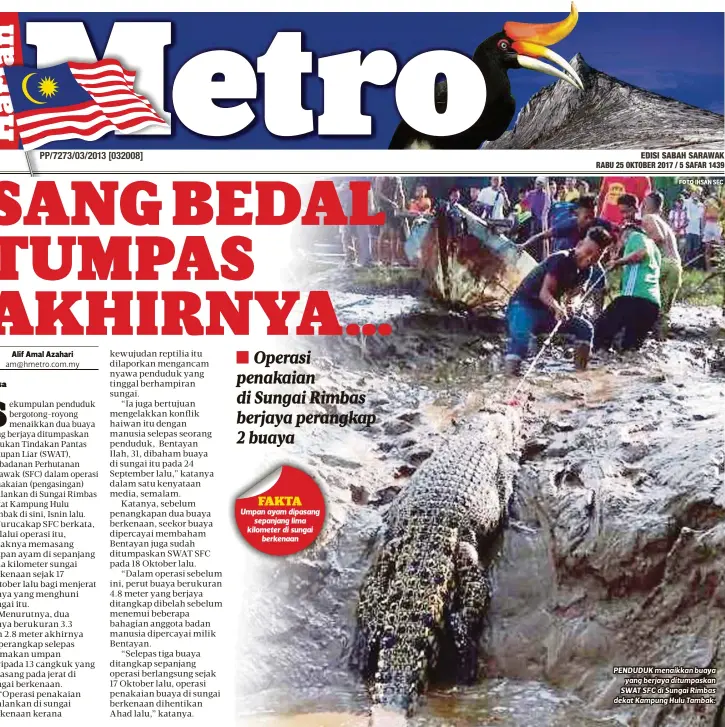  ?? FOTO ?? PENDUDUK menaikkan buaya
yang berjaya ditumpaska­n SWAT SFC di Sungai Rimbas dekat Kampung Hulu Tambak.