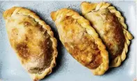  ?? MARIAH TAUGER Los Angeles Times/TNS ?? Crumbly bits of pecans mimic the texture of browned ground beef but retain a nice crunch for vegan picadillo empanadas.