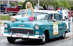  ?? Westside Eagle Observer/MIKE ECKELS ?? Bethany Roberson rides atop her father’s 1956 Chevy Bel Air during the Decatur Barbecue parade on Aug. 5, 2017. The parade will make its way down Main Street to Veterans Park in Decatur at 1:30 p.m. Saturday, Aug. 4.