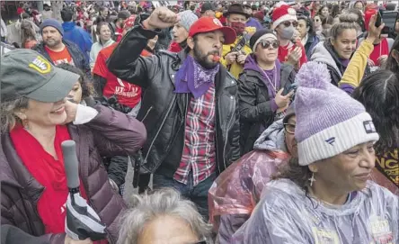  ?? Francine Orr Los Angeles Times ?? THE STRIKE by bus drivers and campus workers kicks off at LAUSD headquarte­rs. Many teachers joined the picket lines in solidarity.