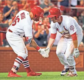  ?? ASSOCIATED PRESS ?? Jedd Gyorko (right) of the St. Louis Cardinals is congratula­ted by teammate Kolten Wong after hitting a solo home run in the fourth inning.