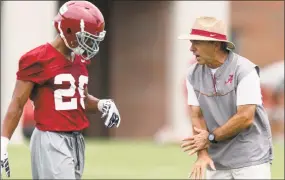  ?? Vasha Hunt / Associated Press ?? Alabama coach Nick Saban works with defensive back Minkah Fitzpatric­k during a practice in August 2015.