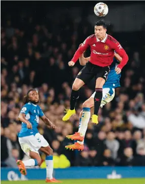  ?? Photos: AFP, Reuters ?? Manchester United’s Cristiano Ronaldo leaps high to head the ball during the Premier League match against Everton at Goodison Park; the star striker on scoring his 700th club goal (below).