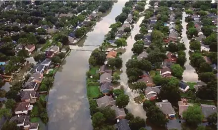  ?? REUTERS PIC ?? Houses partially submerged in floodwater­s caused by Hurricane Harvey in Northwest Houston, Texas, last month.