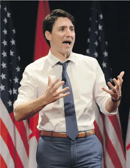  ?? THE CANADIAN PRESS ?? Justin Trudeau speaks at the University of Chicago on Wednesday. Back home, his defence minister fielded questions about the government’s view on safe workplaces for women. —