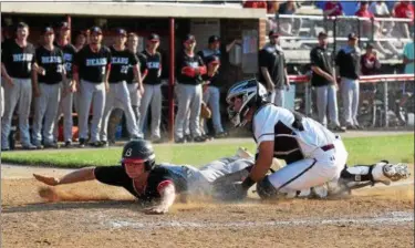  ?? AUSTIN HERTZOG - DIGITAL FIRST MEDIA ?? Boyertown’s Austyn Levengood dives to home plate and beats the tag of Conestoga’s Luke Czeipel to score a run during a District 1-6A quarterfin­al Friday.