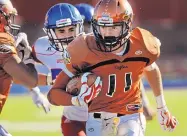  ?? JIM THOMPSON/JOURNAL ?? Eldorado’s Colin Barz (11) looks for open space in Saturday’s Class 6A playoff game at Wilson Stadium. The Eagles advanced with a 56-35 victory.