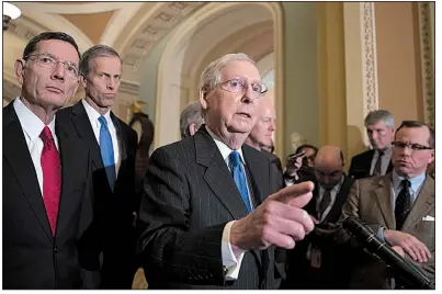  ?? AP/J. SCOTT APPLEWHITE ?? Senate Majority Leader Mitch McConnell, joined by fellow Republican Sens. John Barrasso of Wyoming and John Thune of South Dakota, speaks Tuesday after a strategy session at the Capitol in Washington. The Senate later approved the farm bill.