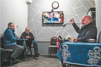  ?? AFP ?? People follow the news as they sit inside a traditiona­l Turkish tea house in Bayburt. The first round vote saw almost 80 per cent of the province’s electors plump for Erdogan.