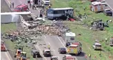  ??  ?? This image from KQRENews13 video shows the scene on Interstate 40 where a Phoenix-bound Greyhound bus and a tractor-trailer rig collided Thursday near Thoreau, N.M. Four people died.