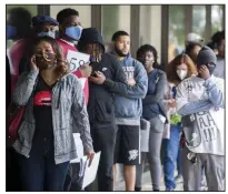  ?? (Arkansas Democrat-Gazette/Stephen Swofford) ?? People line up Friday outside an unemployme­nt office in Little Rock as U.S. job losses mount. More photos at arkansason­line.com/59job/.