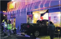  ?? Courtesy Ajman Police ?? A woman and a nine-year-old boy died when a pick-up crashed into a fast-food restaurant at a petrol station in Ajman.