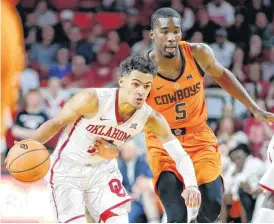  ?? [PHOTO BY BRYAN TERRY, THE OKLAHOMAN] ?? Oklahoma’s Trae Young surges past Oklahoma State’s Tavarius Shine during Wednesday’s Bedlam basketball game at Lloyd Noble Center in Norman. The Sooners won, 109-89.