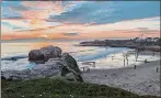  ?? PAUL ROGERS — BAY AREA NEWS GROUP ?? Beachgoers enjoy a sunset on Jan. 17 at Natural Bridges State Beach in Santa Cruz.