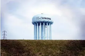  ?? ?? The Flint water tower last month. Photograph: Carlos Osorio/AP