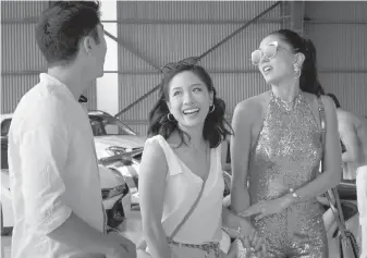  ??  ?? Henry Golding, Constance Wu, centre, and Sonoya Mizuno in Crazy Rich Asians.