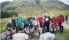  ??  ?? Calum MacFarlane-Barrow led the party of walkers to the mountain summit on Sunday.