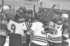 ?? ?? Members of the Oyster River/Portsmouth girls hockey team celebrate a goal in last year’s Division I semifinal against Hanover. The ClipperCat­s are poised to make another run at a state championsh­ip this season.