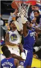  ?? RAY CHAVEZ — STAFF ?? The Warriors’ D’Angelo Russell, center, deflects a shot by Montrezl Harrell of the Clippers on Thursday. Russell had 20 points and eight assists in his Warriors debut.