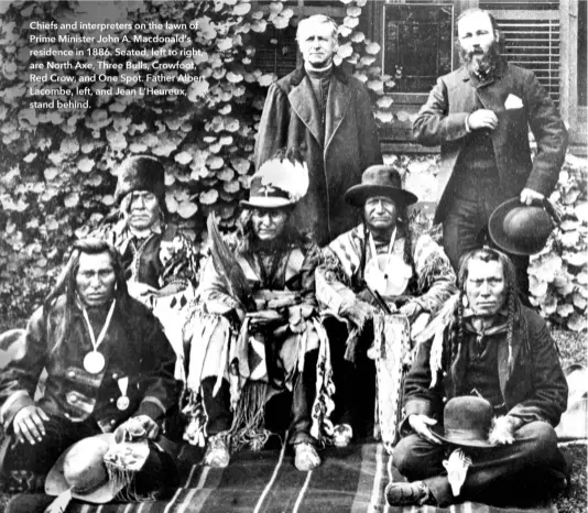  ??  ?? Chiefs and interprete­rs on the lawn of Prime Minister John A. Macdonald’s residence in 1886. Seated, left to right, are North Axe, Three Bulls, Crowfoot, Red Crow, and One Spot. Father Albert Lacombe, left, and Jean L’Heureux, stand behind.