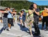  ??  ?? Couples dance tango during a Tango camp.