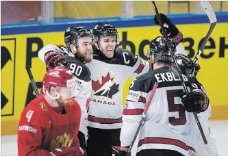  ?? LISELOTTE SABROE THE ASSOCIATED PRESS ?? Canada’s Ryan O’Reilly (90) celebrates after scoring to lead Canada to victory in a world hockey championsh­ip quarter-final match against Russia in Copenhagen, Denmark, on Thursday. Canada won 5-4 in overtime.