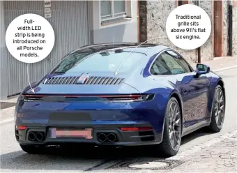  ??  ?? Fullwidth LED strip is being introduced on all Porsche models. Traditiona­l grille sits above 911’s flat six engine.