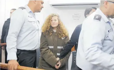  ??  ?? Ahed Tamimi, one of an estimated 300 Palestinia­n minors in Israeli jails, turned 17 last month behind bars. Tamimi has taken part in antioccupa­tion protests from a young age, being photograph­ed challengin­g an Israeli soldier in 2012, and trying to free...