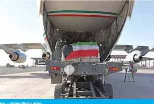  ?? — Defense Ministry photos ?? KUWAIT: Medical supplies donated by Kuwait to Lebanon are loaded into a Kuwait Air Force plane on Friday.