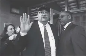  ?? ASSOCIATED PRESS ?? Mohammed Nuru (center), director of San Francisco Public Works, gestures Thursday as he leaves a federal courthouse with attorney Ismail Ramsey (right) in San Francisco. The FBI arrested Nuru and restaurate­ur Nick Bovis last week, saying the men schemed in 2018 to bribe a San Francisco airport commission­er for prime restaurant space at San Francisco Internatio­nal Airport.