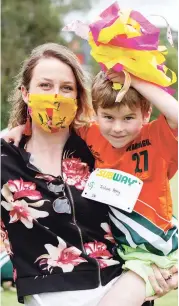  ??  ?? Travelling from Melbourne to cheer on her nephews at Little Athletics was Philomena Butterwort­h with Julian Perry.