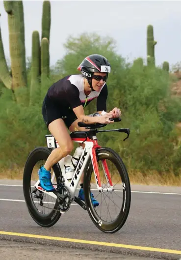  ??  ?? ABOVE Elmore races Ironman Arizona 2016