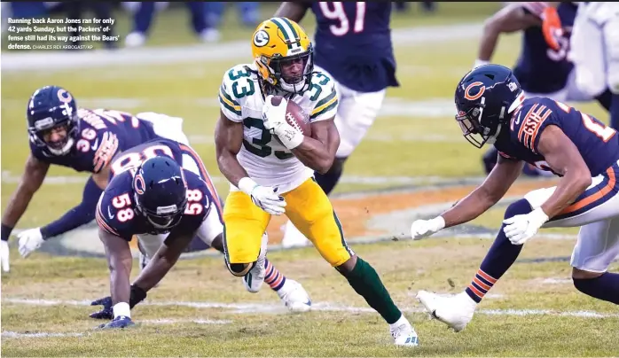  ?? CHARLES REX ARBOGAST/AP ?? Running back Aaron Jones ran for only 42 yards Sunday, but the Packers’ offense still had its way against the Bears’ defense.