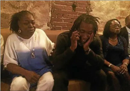  ?? JOHN KAMPF — THE NEWS‑HERALD ?? Kareem Hunt, with his mother Stephanie by his side, gets the call from the Chiefs informing him they were selecting him in the NFL draft.