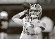  ?? Jeff Siner / Associated Press ?? Why shouldn’t Clemson star quarterbac­k Trevor Lawrence be paid for his work on the field?