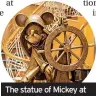  ??  ?? The statue of Mickey at the helm in the atrium of the Disney Magic