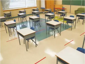  ??  ?? When schools reopen, expect desks to be spaced apart like these in a classroom at St. Emily school.