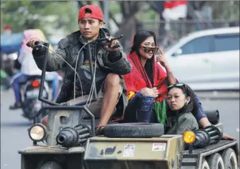  ?? DARREN WHITESIDE / REUTERS ?? Vespa fans ride their creations during weekend scooter festival in Kediri, East Java, Indonesia, earlier this month.