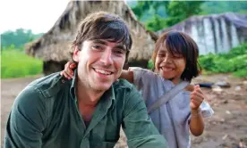  ?? Photograph: Craig Hastings/BBC/The Garden Production­s ?? The presenter with a Colombian tribal boy for his 2015 series Caribbean with Simon Reeve.