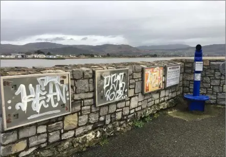  ??  ?? The graffiti covered and empty informatio­n boards and broken telescope at Soldier’s Point on the Navvy Bank.