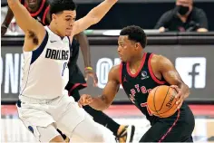  ?? AP Photo/Chris O’Meara ?? Toronto Raptors guard Kyle Lowry (7) drives against Dallas Mavericks guard Josh Green (8) during the second half of an NBA game Monday in Tampa, Fla.