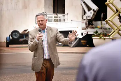  ?? Staff photo by Danielle Dupree ?? ■ Local entreprene­ur David Peavy addresses onlookers Tuesday across the street from the former Texarkana National Bank building downtown. Peavy’s company Texarkana Renewal Properties plans to rehabilita­te the century-old structure.