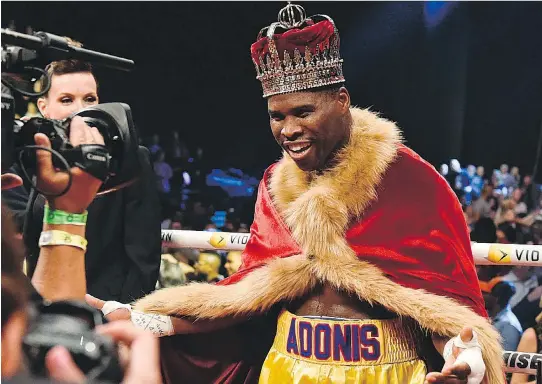  ?? MINAS PANAGIOTAK­IS/GETTY IMAGES ?? Adonis Stevenson wore his crown proudly after beating Andrzej Fonfara in their WBC light-heavyweigh­t championsh­ip fight at the Bell Centre Saturday.