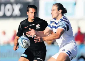  ?? PHOTO: David Rogers/getty Images ?? Max Clark passes away from the attentions of Saracens’ Alex Lozowski